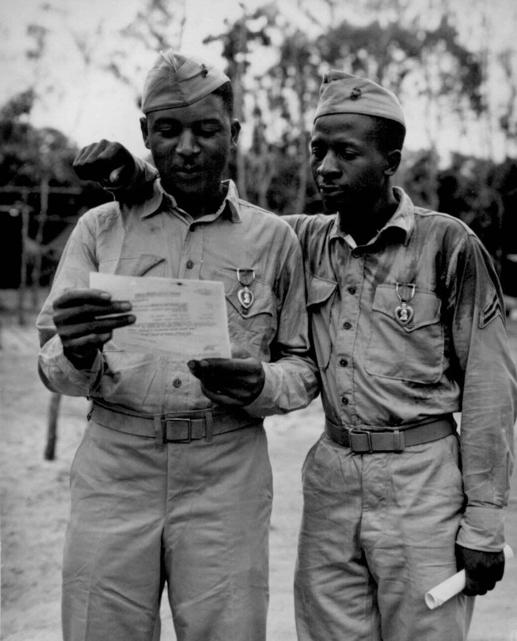 Tuskegee Airmen reviewing orders